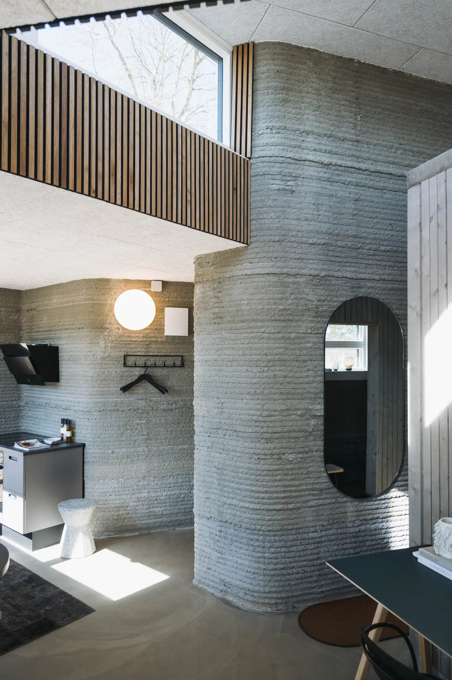 Bedroom in a 3D printed concrete house in Denmark