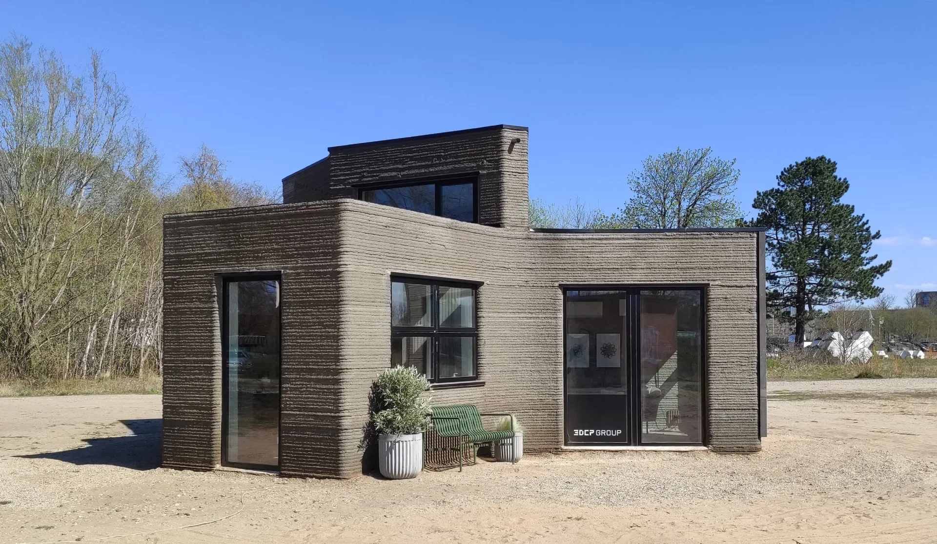 Exterior of 3DCP Group's prototype 3D printed concrete house in Holstebro