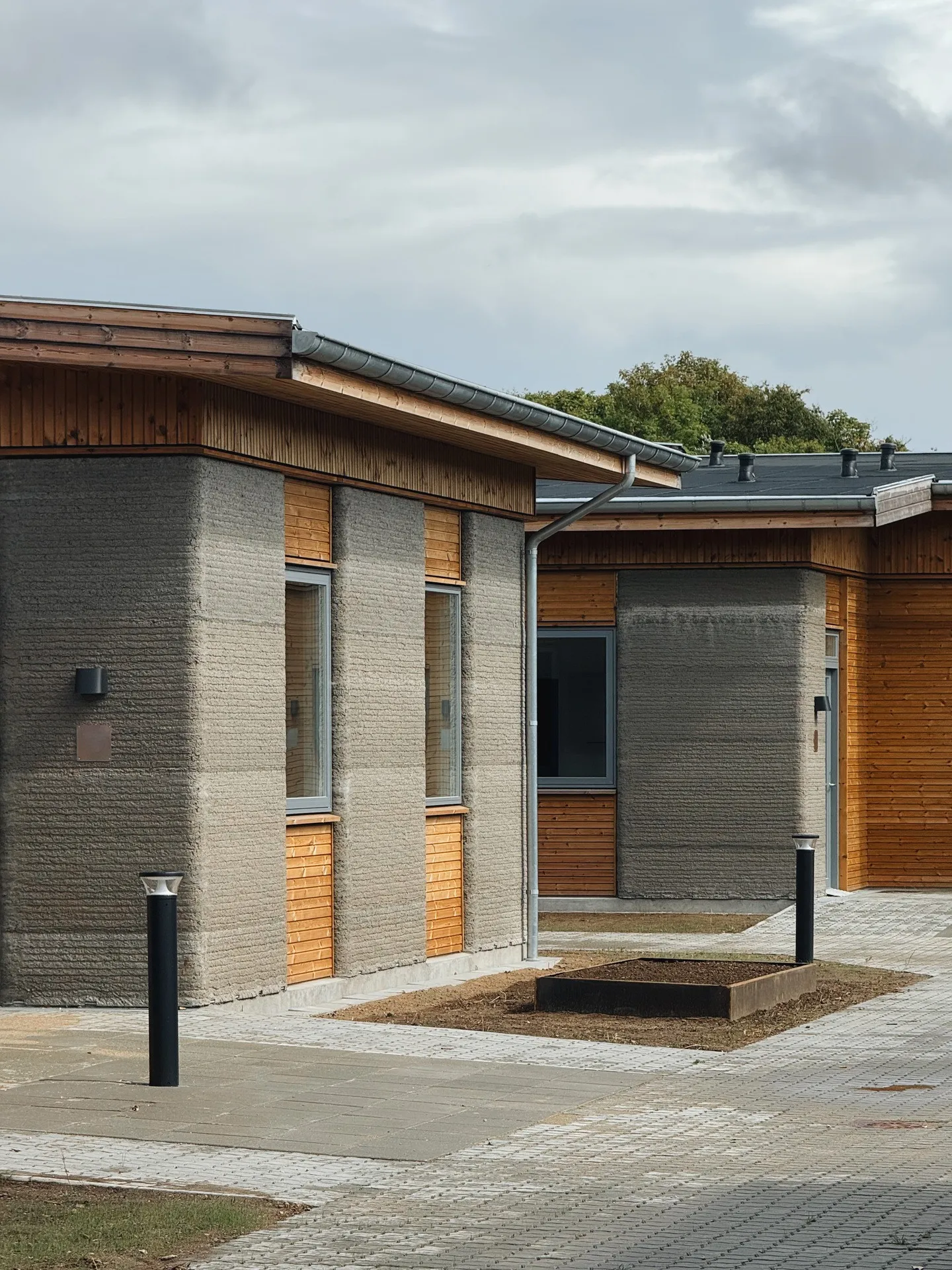 Finished printed facade and timber-clad entrance
