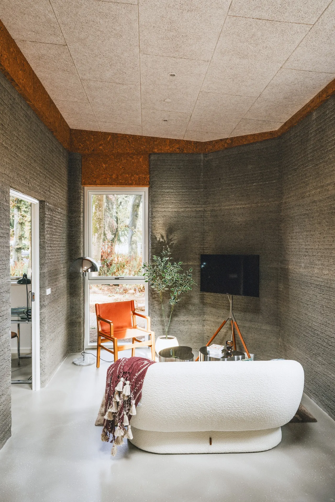 Living space with printed walls and a view outdoors
