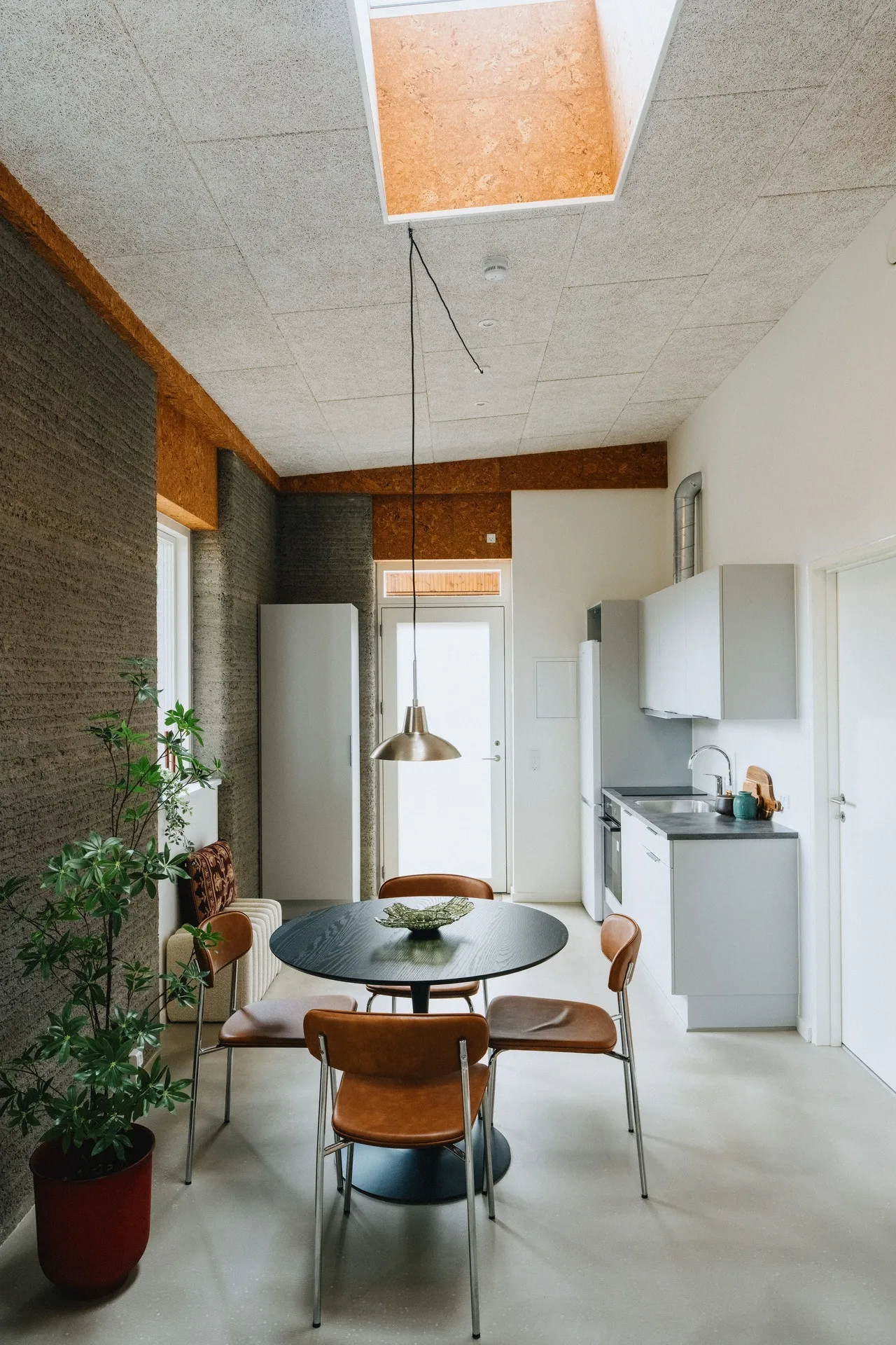 Furnished living area beneath a skylight